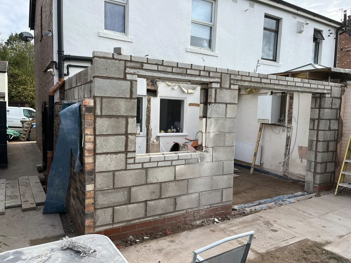 Blockwork extension shell built against an existing house
