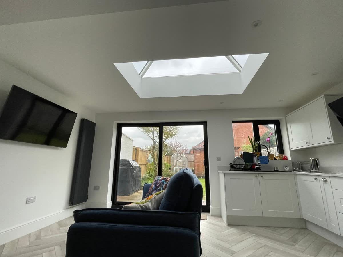 Finished living and kitchen space with rooflight and garden doors
