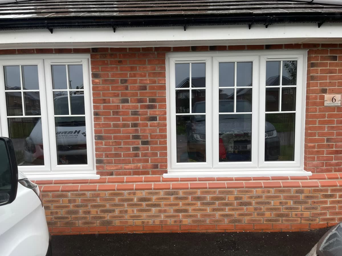 Neat brickwork and new white windows on a residential property